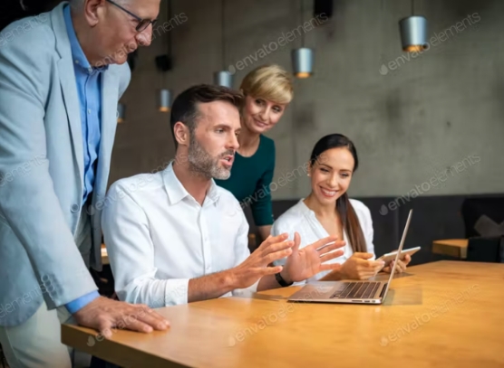 young-woman-works-laptop-takes-notes-notebook 1